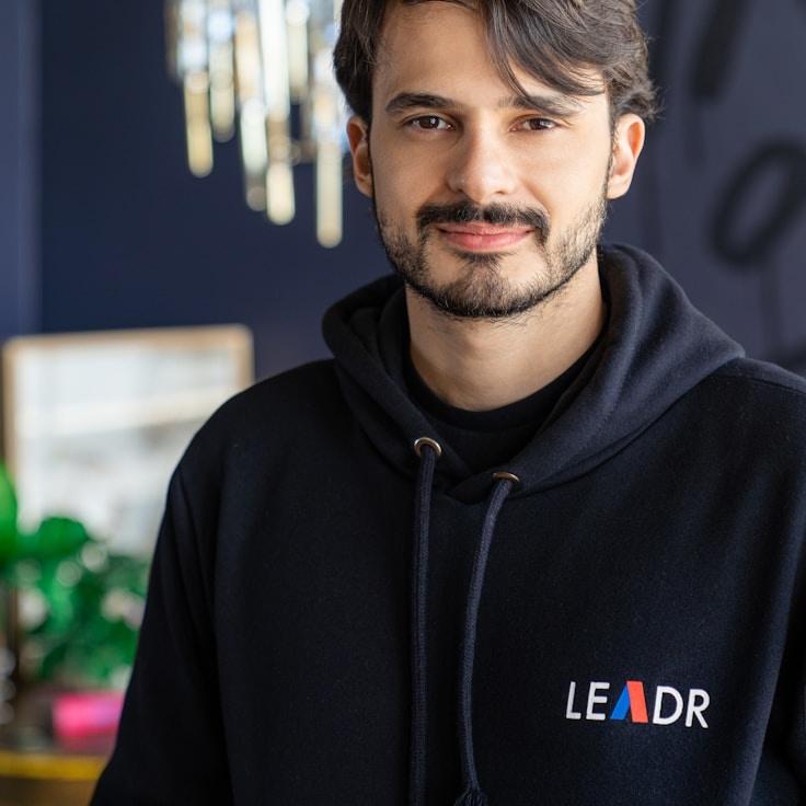 Kaveri Mehta, Lead Design Curator at LedgerPilotTerminal, reviewing corporate floral arrangements